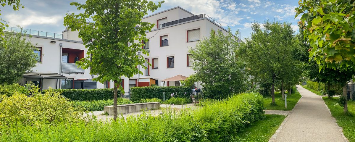 Residential area with ecological and sustainable green residential buildings, low-energy houses with apartments and green courtyard