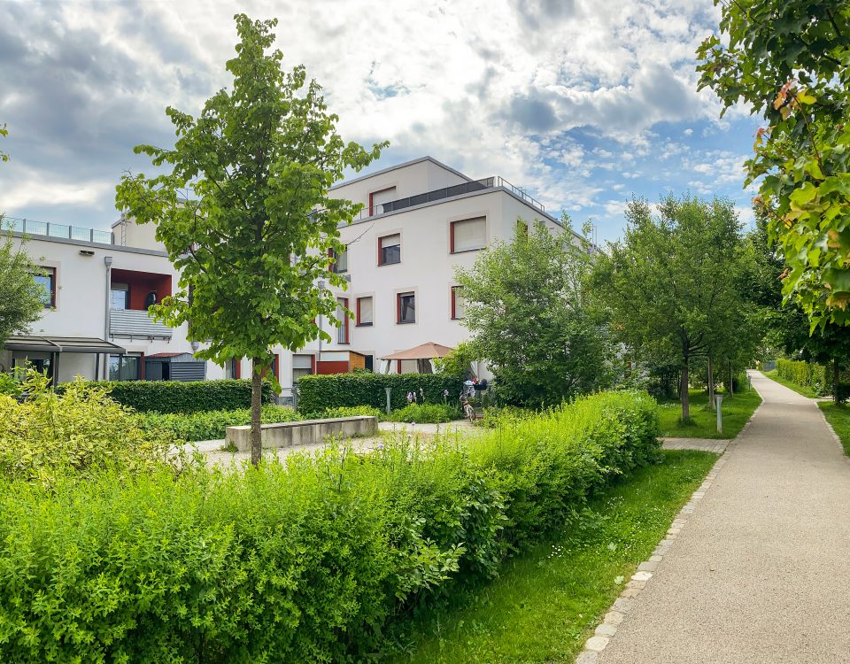 Residential area with ecological and sustainable green residential buildings, low-energy houses with apartments and green courtyard